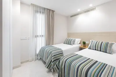 Cama o camas de una habitación en ART en Las Palmas - Viviendas Vacacionales