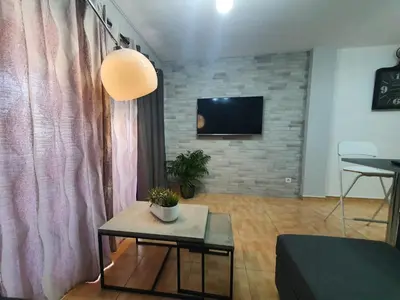 Una televisión o centro de entretenimiento en Surycan, beautiful apartment in maspalomas