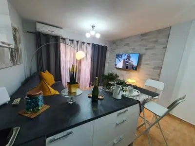 Una televisión o centro de entretenimiento en Surycan, beautiful apartment in maspalomas
