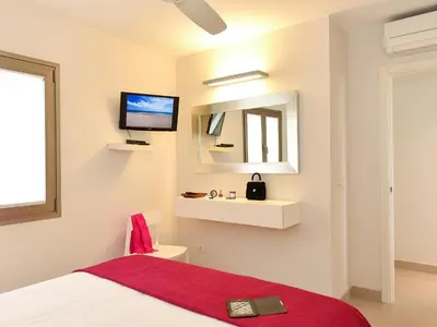 Cama o camas de una habitación en San Agustin Beach Apartments by VillaGranCanaria