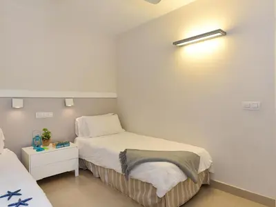 Cama o camas de una habitación en San Agustin Beach Apartments by VillaGranCanaria