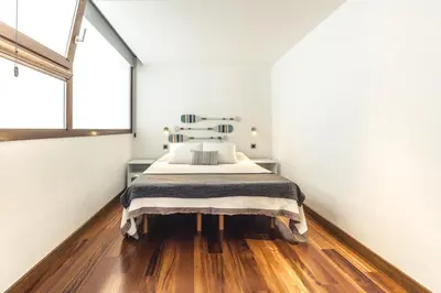 Cama o camas de una habitación en Taliarte Lighthouse Shared Terrace