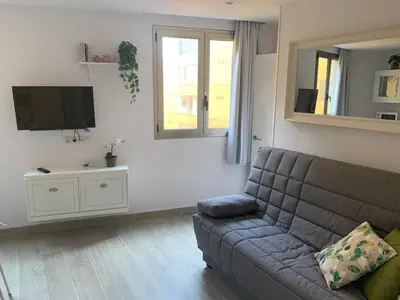 Una televisión o centro de entretenimiento en Apartamento Suite Canteras