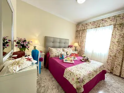 Cama o camas de una habitación en EmyCanarias Primera Línea De Playa