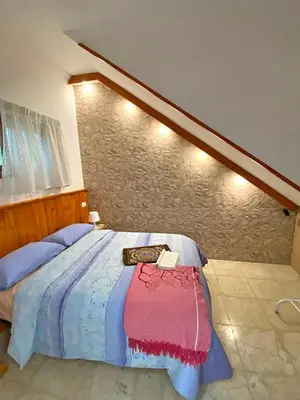 Cama o camas de una habitación en La Luz Vivienda Vacacional