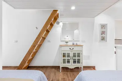 Cama o camas de una habitación en ARGUINEGUIN, BUNGALOWS LOS CANARIOS