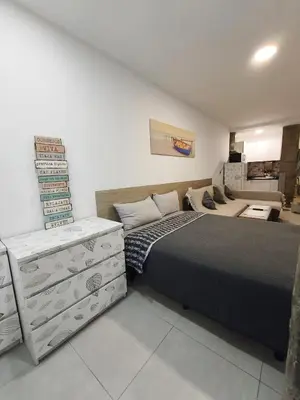 Cama o camas de una habitación en Playa de Las Canteras & Puerto Loft