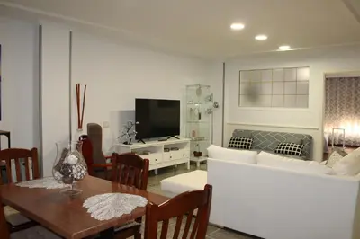 Una televisión o centro de entretenimiento en Apartamento Boutique Cruce de Melenara