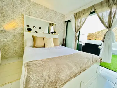 Cama o camas de una habitación en THE MALIBU HOLIDAY CLUB SUITE - PUERTO RICO