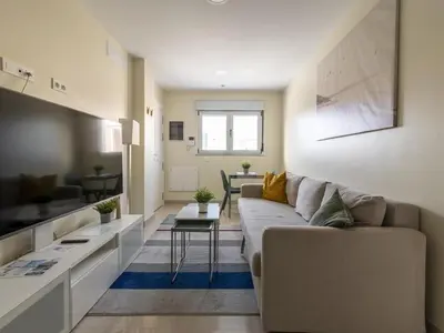 Una televisión o centro de entretenimiento en GuestReady - Nuevos Livian Suites Las Palmas