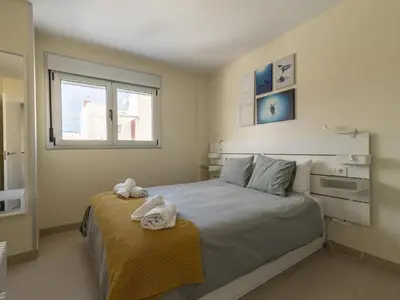 Cama o camas de una habitación en GuestReady - Nuevos Livian Suites Las Palmas