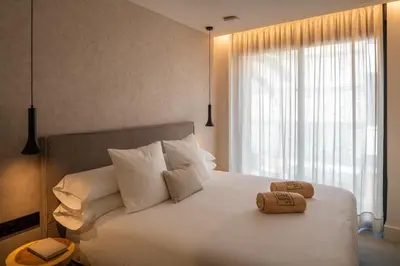 Cama o camas de una habitación en TocToc Suites Olof Palme - Viviendas Vacacionales