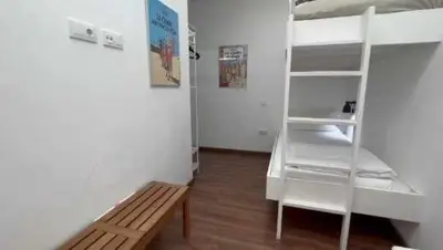 Cama o camas de una habitación en Playa Canteras suites