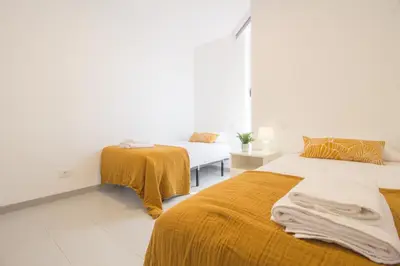 Cama o camas de una habitación en Corner Las Canteras Beach by CanariasGetaway
