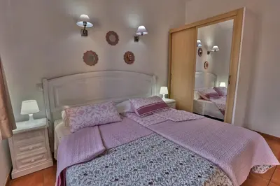 Cama o camas de una habitación en Bungalow Santa Fe con gran terraza