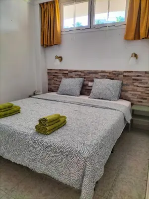 Cama o camas de una habitación en Sunny Apartment Tanife by Yumbo