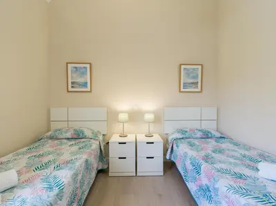 Cama o camas de una habitación en HomeForGuest Modern Apartment in San Agustin 2 min from the beach