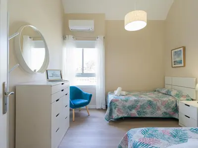 Cama o camas de una habitación en HomeForGuest Modern Apartment in San Agustin 2 min from the beach