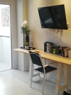 Una televisión o centro de entretenimiento en Modern accommodation in Playa del Inglés