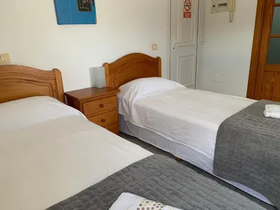 Cama o camas de una habitación en Apartamentos Mar Azul Arinaga