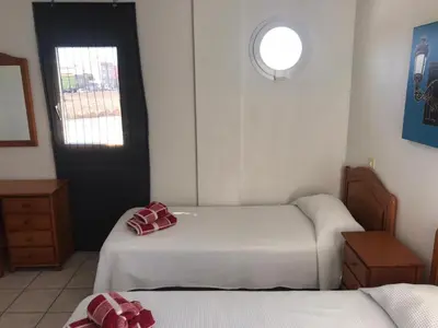 Cama o camas de una habitación en Apartamentos Mar Azul Arinaga