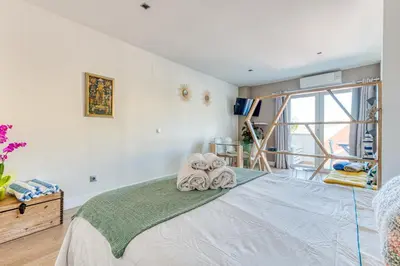 Cama o camas de una habitación en CASITA SUNWAVES- EL 19 DE PADRE CUETO, LAS CANTERAS