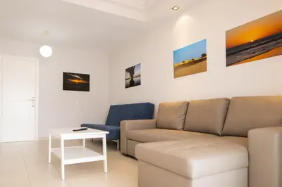 Zona de estar de G g spacious bungalow in maspalomas