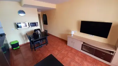 Una televisión o centro de entretenimiento en Vista Bella - Planta baja al lado de la piscina - Ground floor by the pool