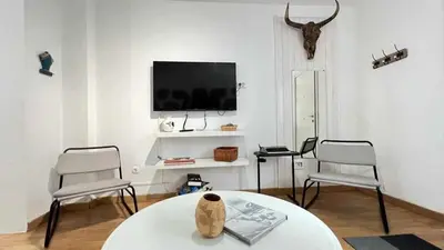 Una televisión o centro de entretenimiento en Estudio Suites Cantera Auditorio