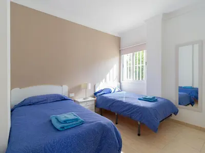 Cama o camas de una habitación en FIRST LINE MOGAN BEACH - Parking free
