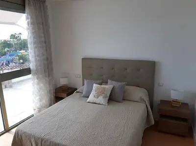 Cama o camas de una habitación en Beachfront Loft in Puerto de Mogan by El Sirocco