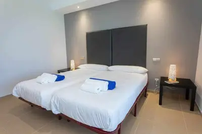 Cama o camas de una habitación en Villa Los Dragos Golf by Infinity Summer
