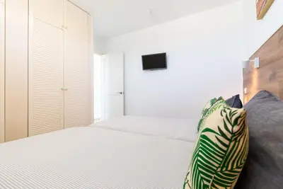 Cama o camas de una habitación en Apartment Palm trees view of the dunes