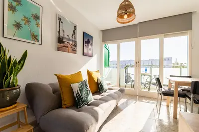 Zona de estar de Apartment Palm trees view of the dunes