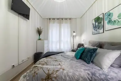 Cama o camas de una habitación en Lovely Hygge Flat in Las Canteras Beach