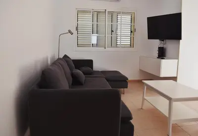 Una televisión o centro de entretenimiento en Duplex en Meloneras