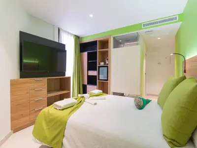 Cama o camas de una habitación en Hotel MG Poniente