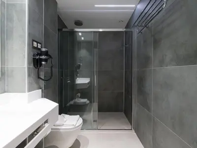 Un baño de Hotel MG Poniente