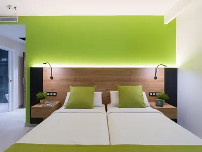 Cama o camas de una habitación en Hotel MG Poniente