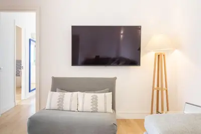 Una televisión o centro de entretenimiento en Las Canteras Ocean View