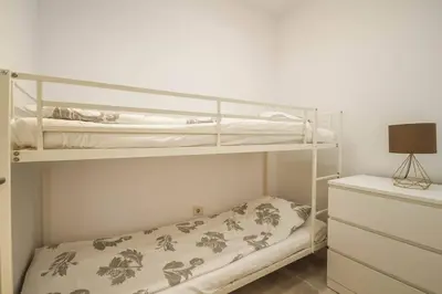 Cama o camas de una habitación en cozy & modern bungalow w/private garden bbq+wifi