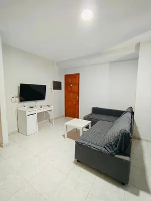 Una televisión o centro de entretenimiento en TABLERO 404, EXCELENTE Apto 6 pax cerca PLAYA DEL INGLES