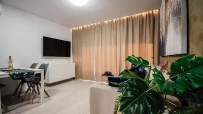 Una televisión o centro de entretenimiento en Don Quijote Apartment