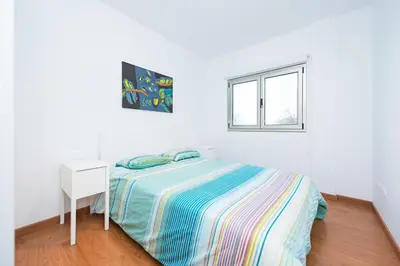 Cama o camas de una habitación en Alojamiento en primera línea de playa en Arinaga