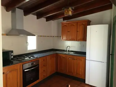 Una cocina o zona de cocina en Finca Mariola - Centenaria