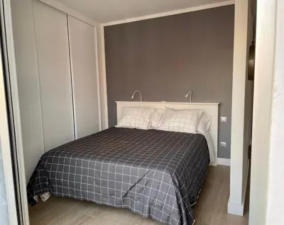 Cama o camas de una habitación en Cosy Seaview Apartment Las Canteras