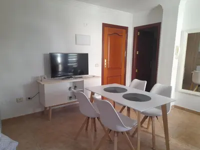 Una televisión o centro de entretenimiento en Apartamento Ocean