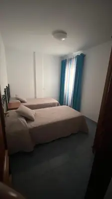 Cama o camas de una habitación en Apartamento Islas Malvinas 39