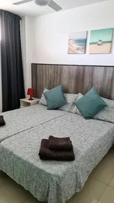 Cama o camas de una habitación en Yumbo Holiday Apartment - Tanife ROOS