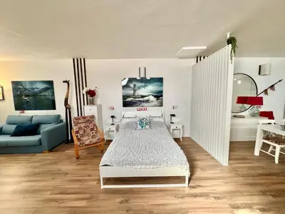 Cama o camas de una habitación en Black Sand Loft